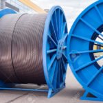179595128-power-cable-on-reels-thick-electrical-wire-concept-production-of-power-cable-large-spools-of